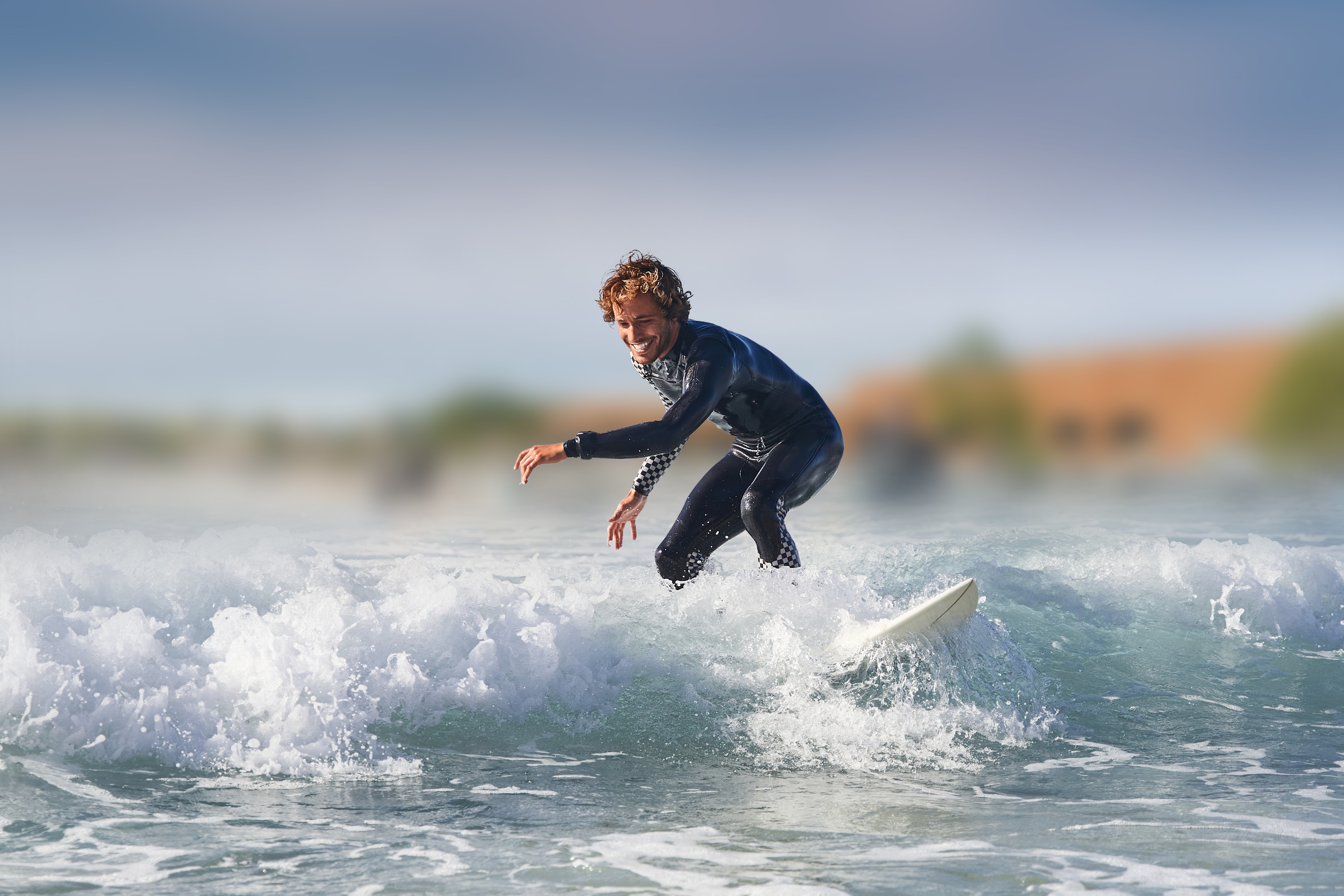 young man surfing